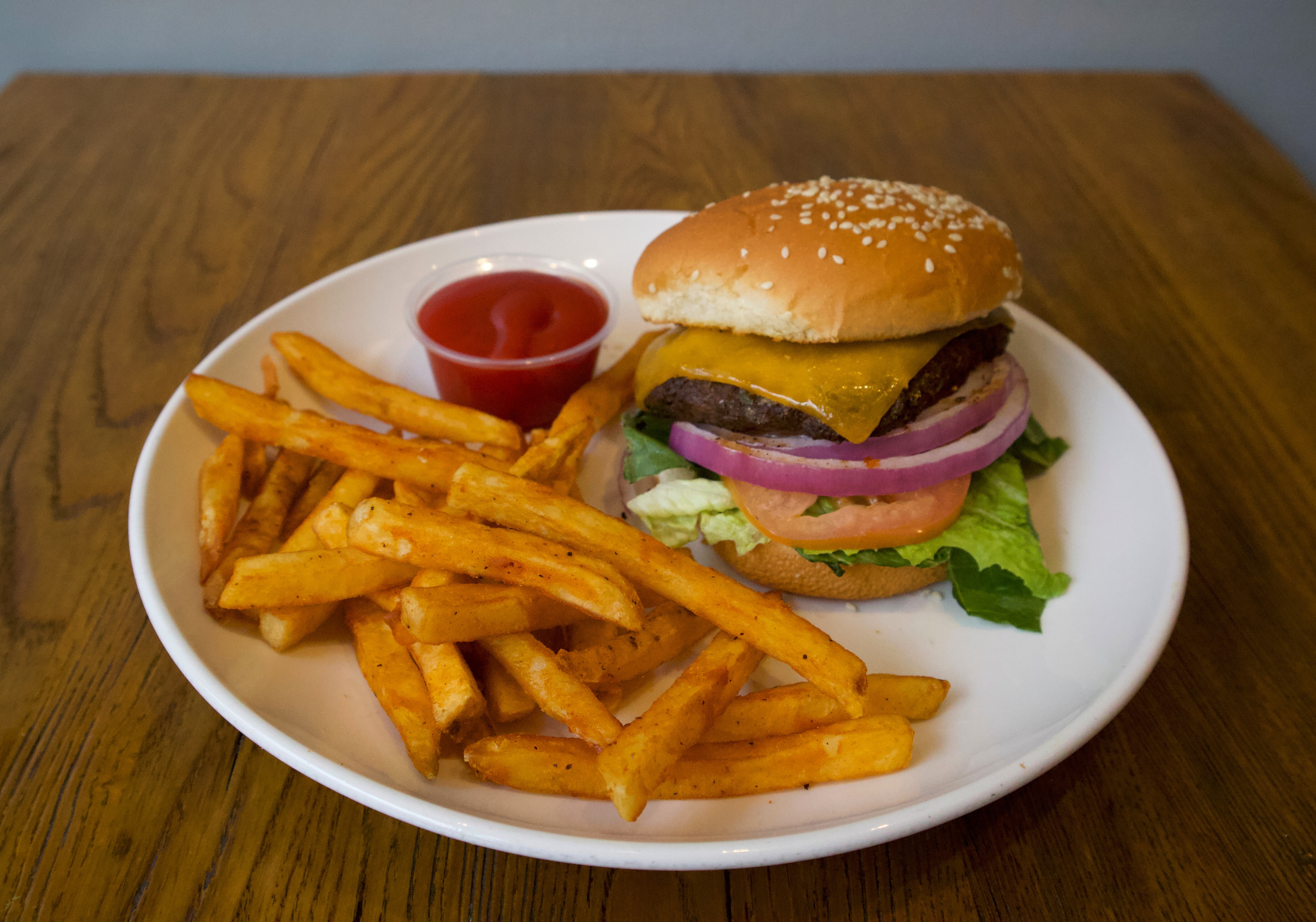 Classic cheeseburger with fries and ketchup